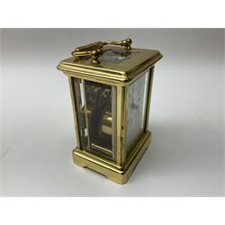 Brass cased carriage clock, the dial inscribed Bornand Freres, with key, H15cm
