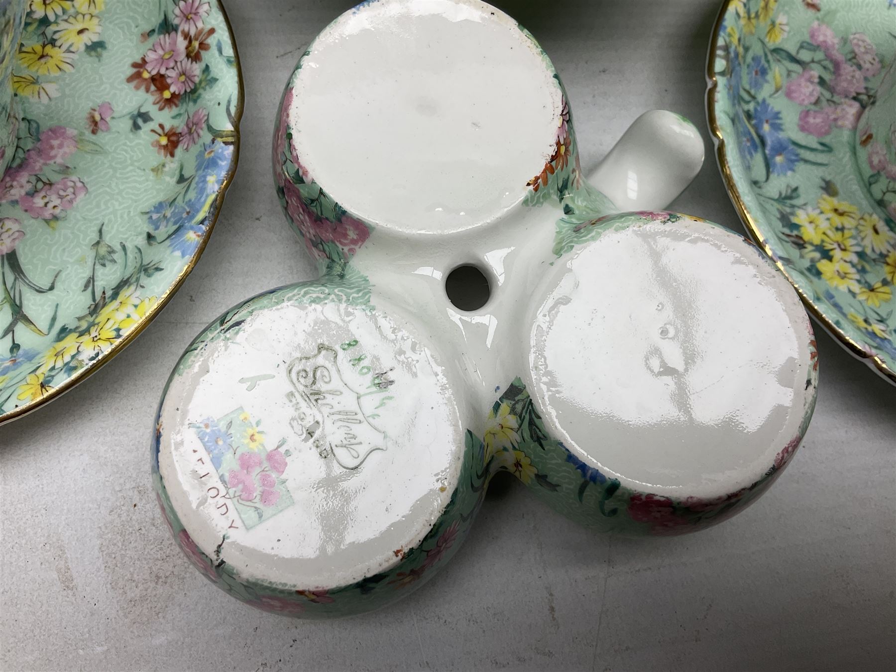 Shelley Melody pattern tea service for six, to include teapot, teapot stand, hot water jug, milk jug, covered sucrier, teacups and saucers, cake plates etc (31)