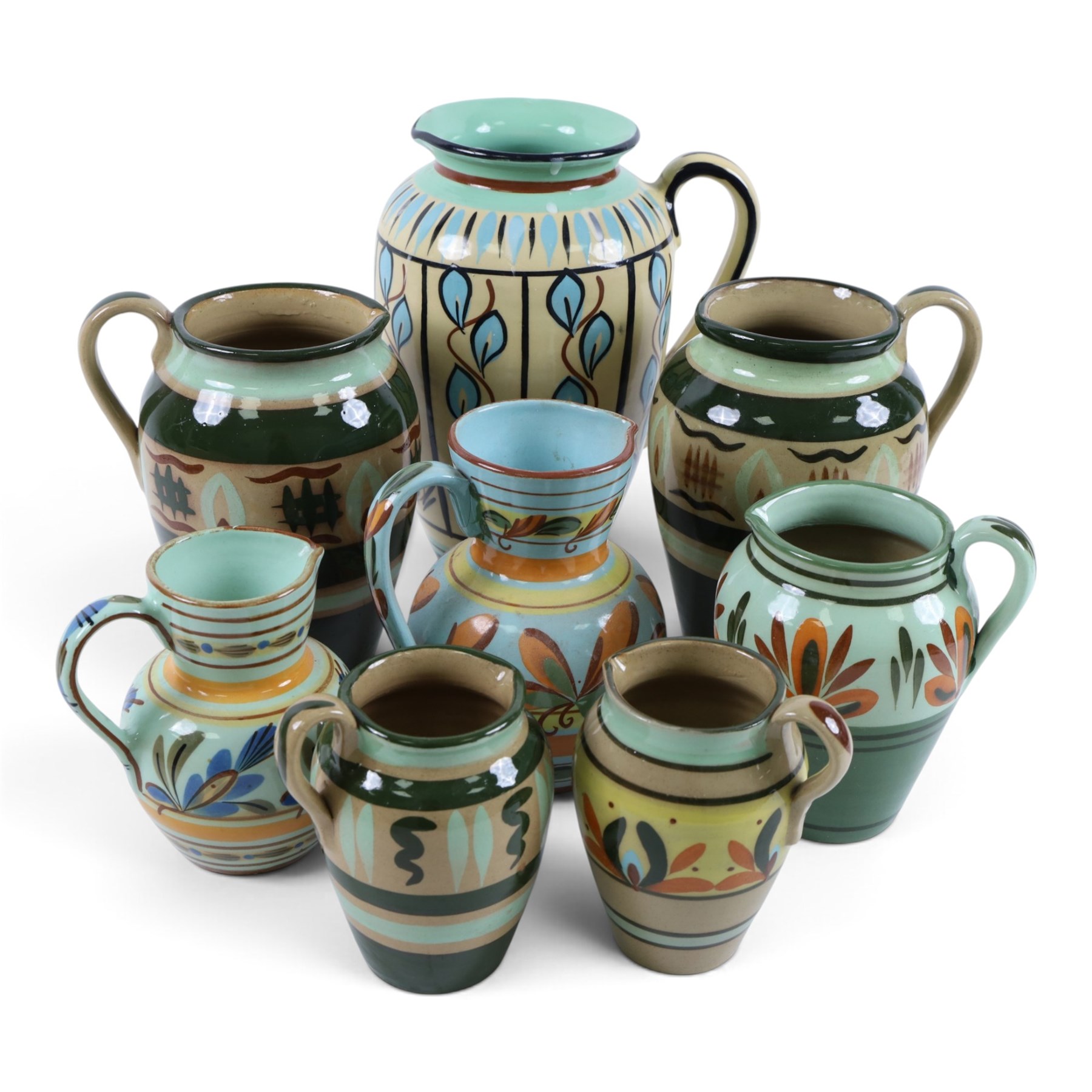 Eight Hartrox and Dee Cee Stoneware jugs, all with floral and abrstact decoration, with printed marks beneath, tallest H24cm