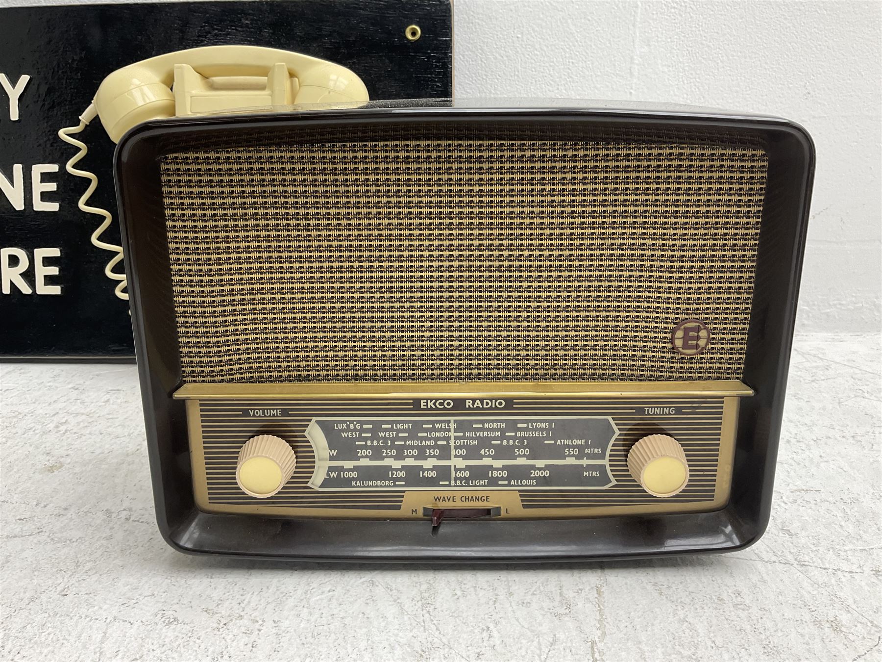 Vintage 1970s telephone mounted on board reading 'You May Telephone From Here', 1960s 706L telephone with 'G.P.O' stamp, 1953 Ecko U195 radio and 1955 Ecko U245 radio