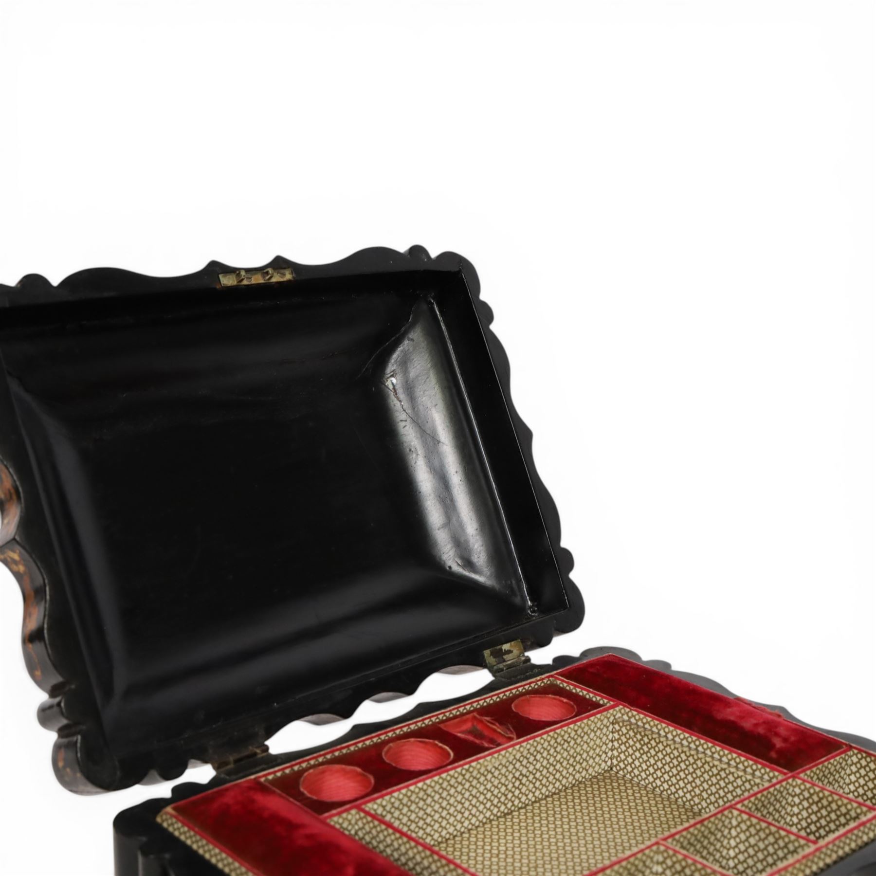Victorian black lacquered papier-mâché sewing box, of rectangular form with shaped sides, the slightly domed top with inlaid mother of pearl and abalone decoration, the sides with gilt and polychrome painted scrollwork, the hinged cover opening to reveal a fitted interior with lift out tray, H14cm