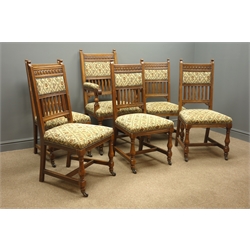  Set six (5+1) Edwardian oak dining chairs, arcade carved cresting rail above shaped uprights, upholstered seats and backs, turned supports with stretchers, ceramic castors  