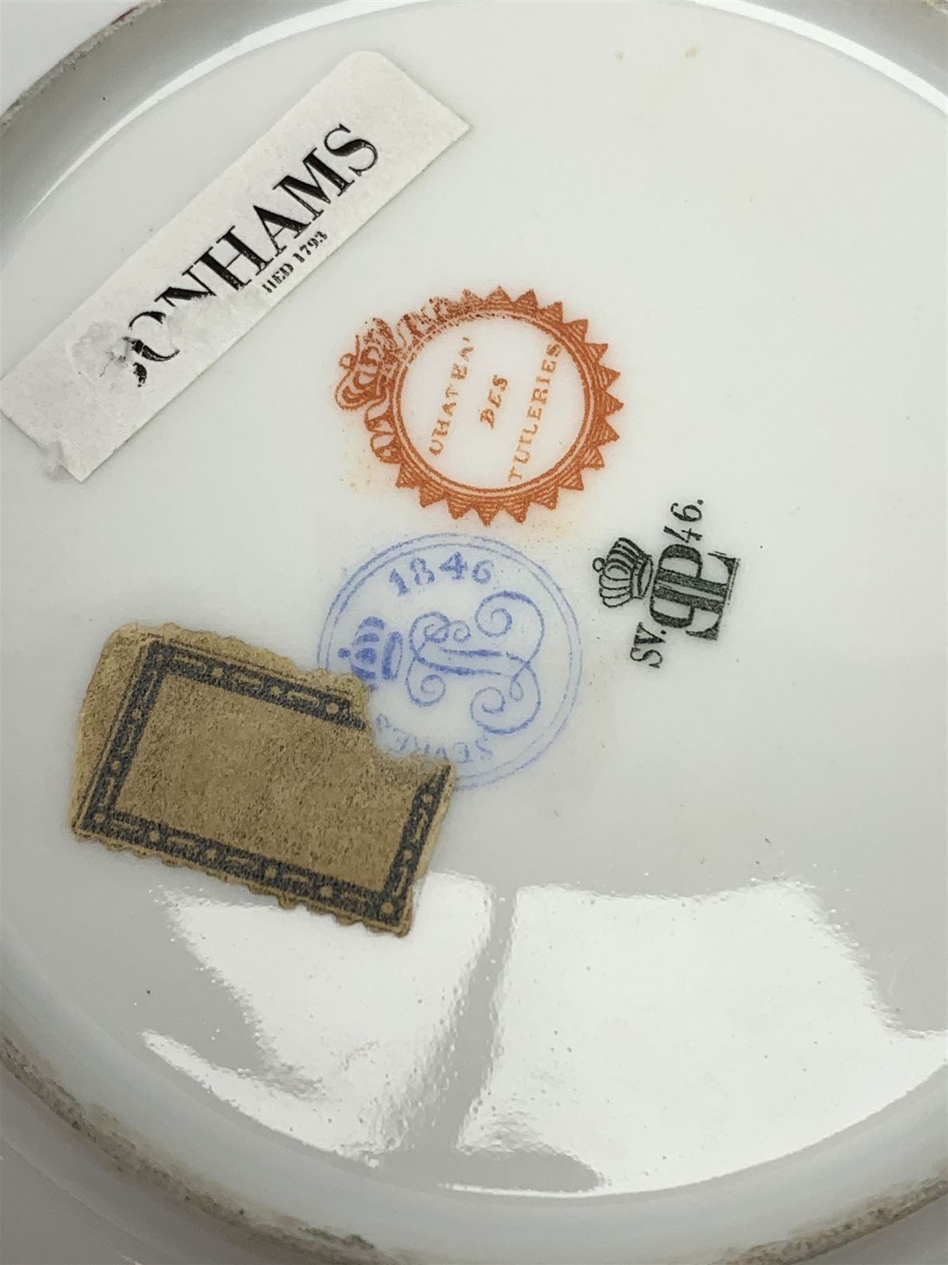 Mid 19th century Sevres Louis Philippe period porcelain cabinet plate, decorated with central Louis Philippe crowned monogram flanked by two cherubs, within cobalt gilt detailed border, with date mark for 1846, red inventory mark for Chateau des Tuileries, and blue monogram mark , D14.5cm