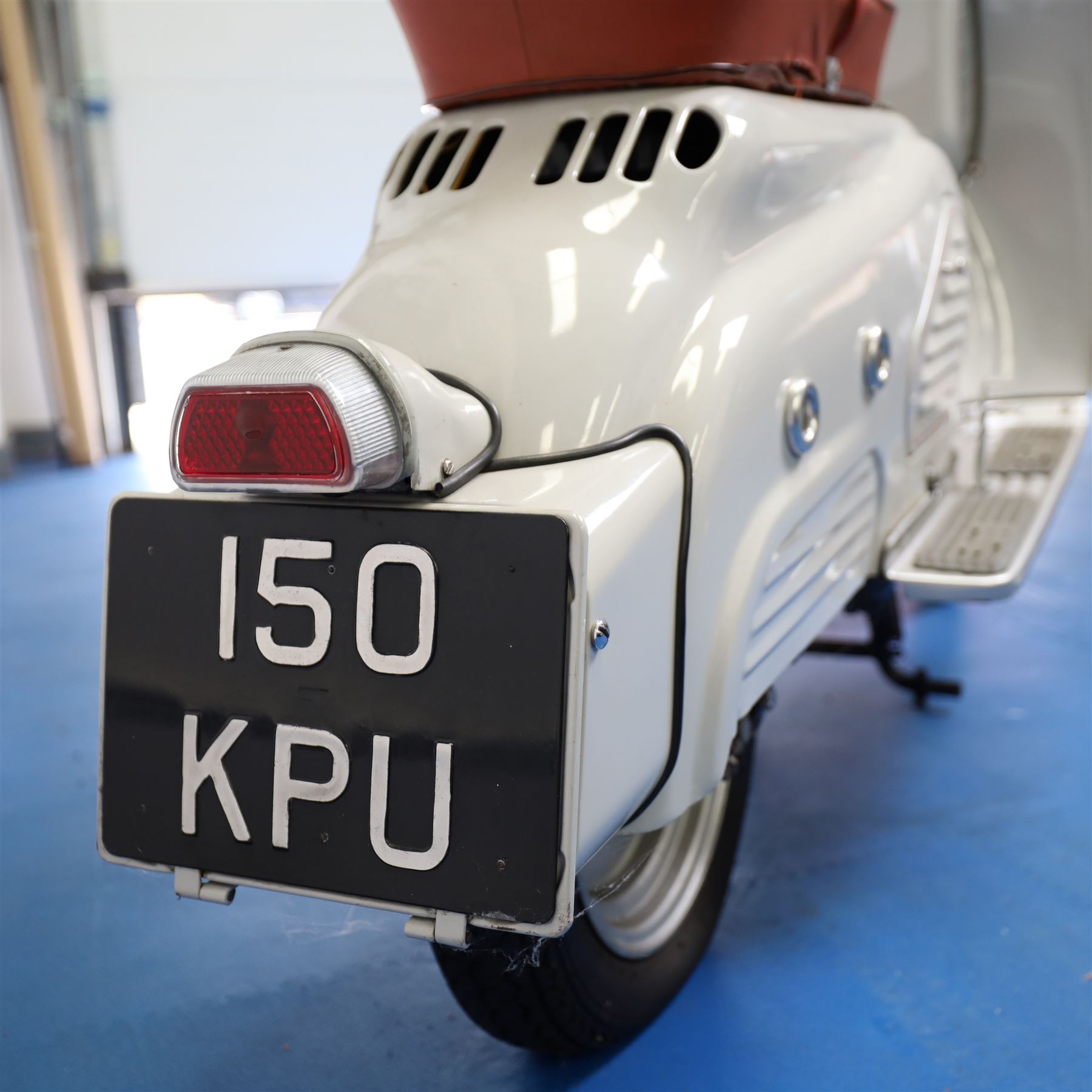 1957 Zündapp Bella R154 Scooter

• Registration: 150 KPU
• Year: 1957
• Model: Bella R154
• Engine: 150cc two-stroke single-cylinder petrol
• Transmission: Four-speed manual
• Odometer reading: 1,727 miles
• Colour: Ivory
• Seating: Dual seat
• V5C: Present
• Original registration book: Present
• Keys: 1

A characterful 1957 Zündapp Bella R154 scooter, finished in ivory with a contrasting brown dual seat and displaying an odometer reading of 1,727 miles.

The Bella R154 formed part of Zündapp’s distinctive range of German touring scooters, combining a 150cc air-cooled two-stroke engine with four-speed transmission, large wheels and substantial pressed-steel bodywork. This example retains its enclosed front apron, central headlamp, chrome handlebars, brightwork, period VDO speedometer and decorative Bella badging.

An operation and maintenance manual is include and accompanied by its V5C and original registration book from 1957.

This vehicle forms part of the Estate of the Late John Sills and is offered for sale by the Executors, confirming a genuine reason for sale.