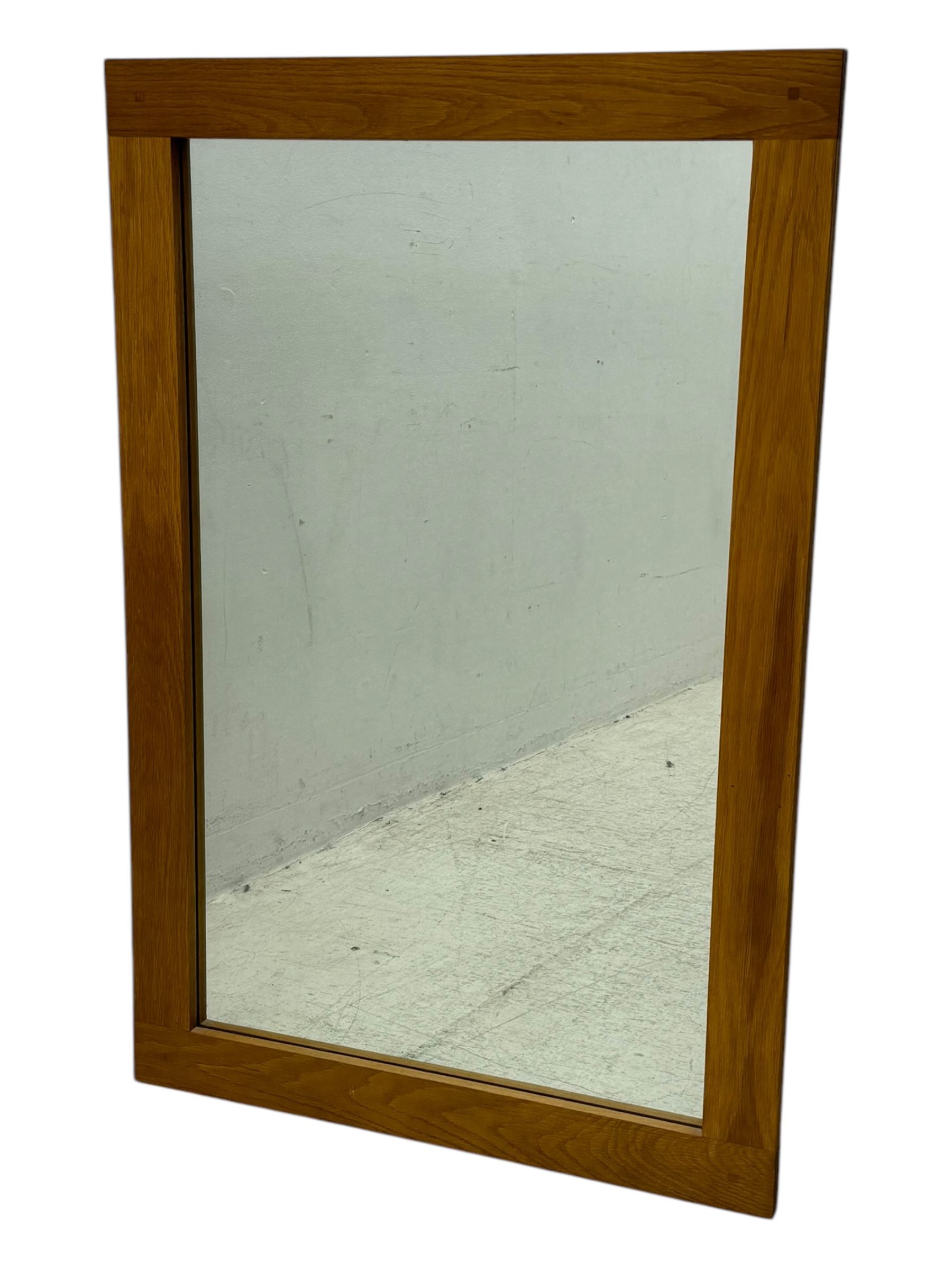 Four decorative mirrors, including gold-toned triptych dressing mirror with foliate borders, two rectangular framed mirrors and a circular gilt mirror with ornate edging