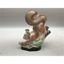 Six Rye Pottery figures, comprising, jumping fox, squirrel upon a branch, billy goat, bull, chicken and cockerel  