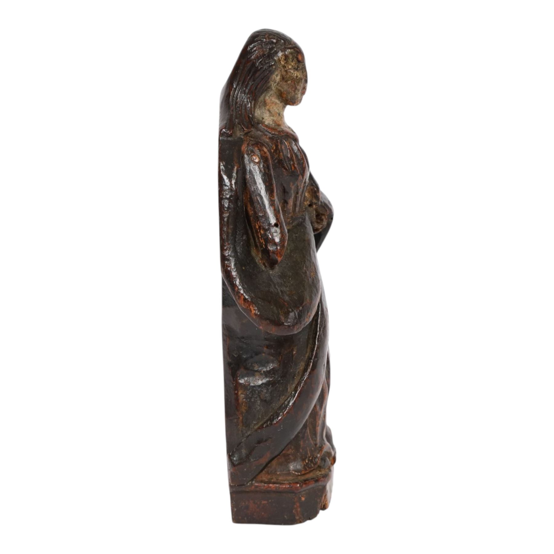 17th century carved limewood figure of a saint, with traces of original polychrome painted decoration, H20.5cm