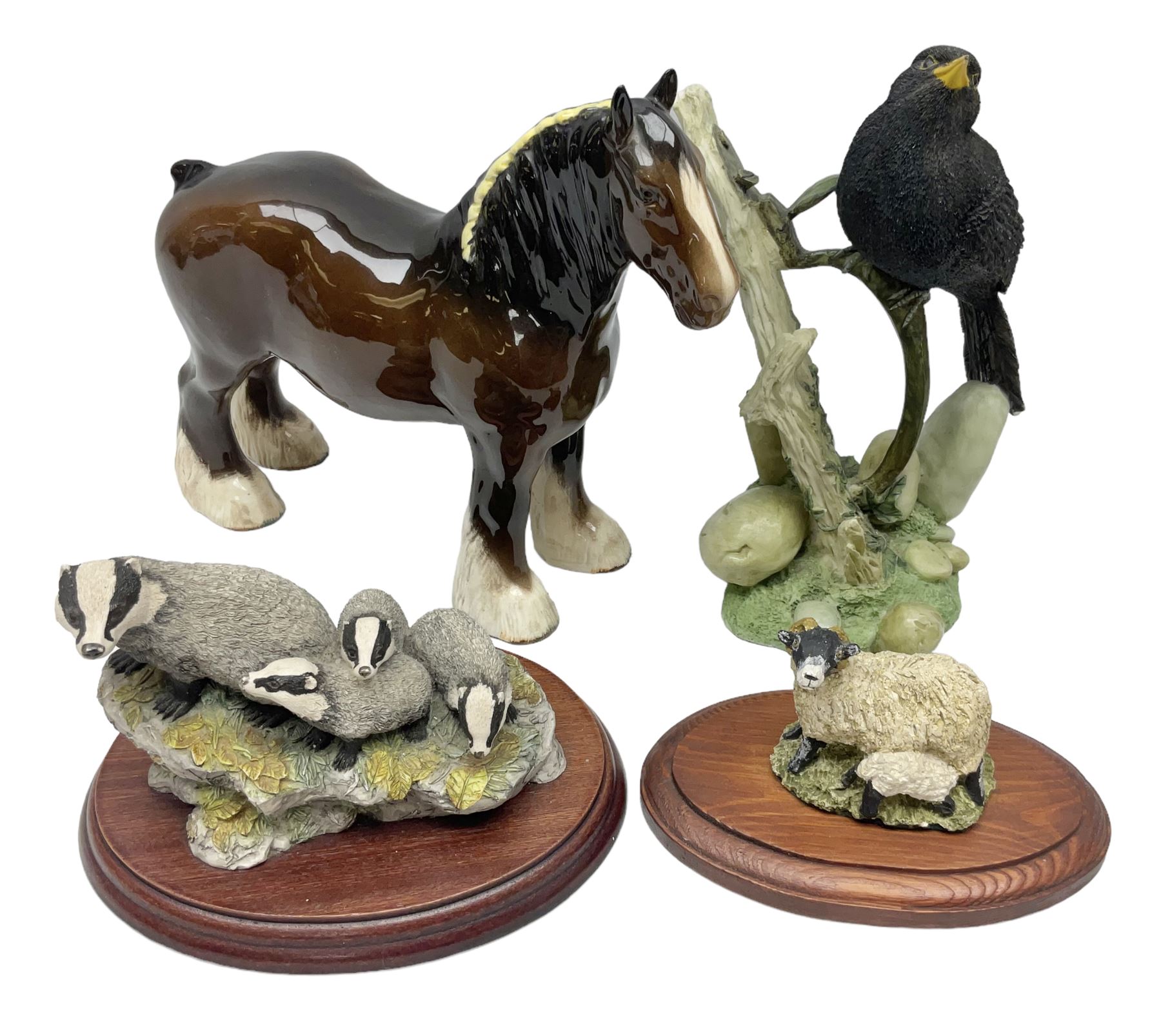 Two Border Fine Arts figures, comprising Badgers and Blackbird, together with Beswick bay shire horse no 818 and another figure
