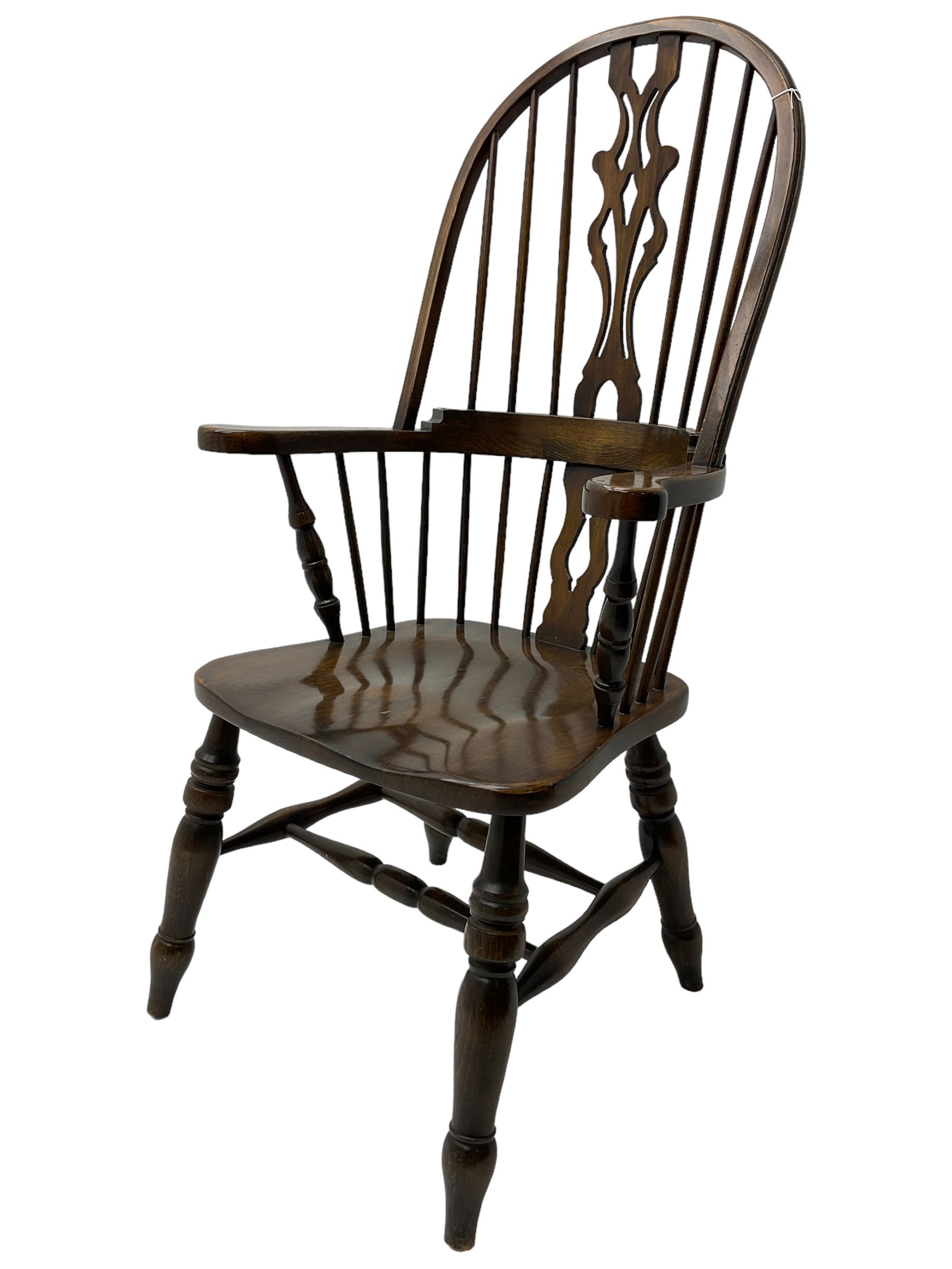 Stained beech Windsor armchair, double hoop and stick back with shaped and pieced splat back, on turned supports united by double swell-turned H stretchers