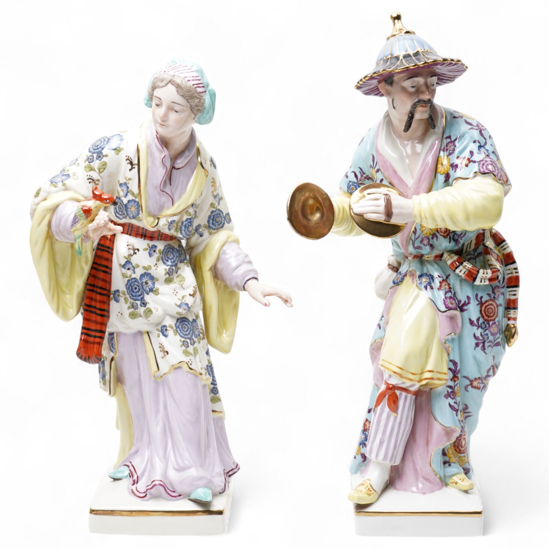 Pair of Continental polychrome Chinese male and female standing figures wearing floral robes H42cm