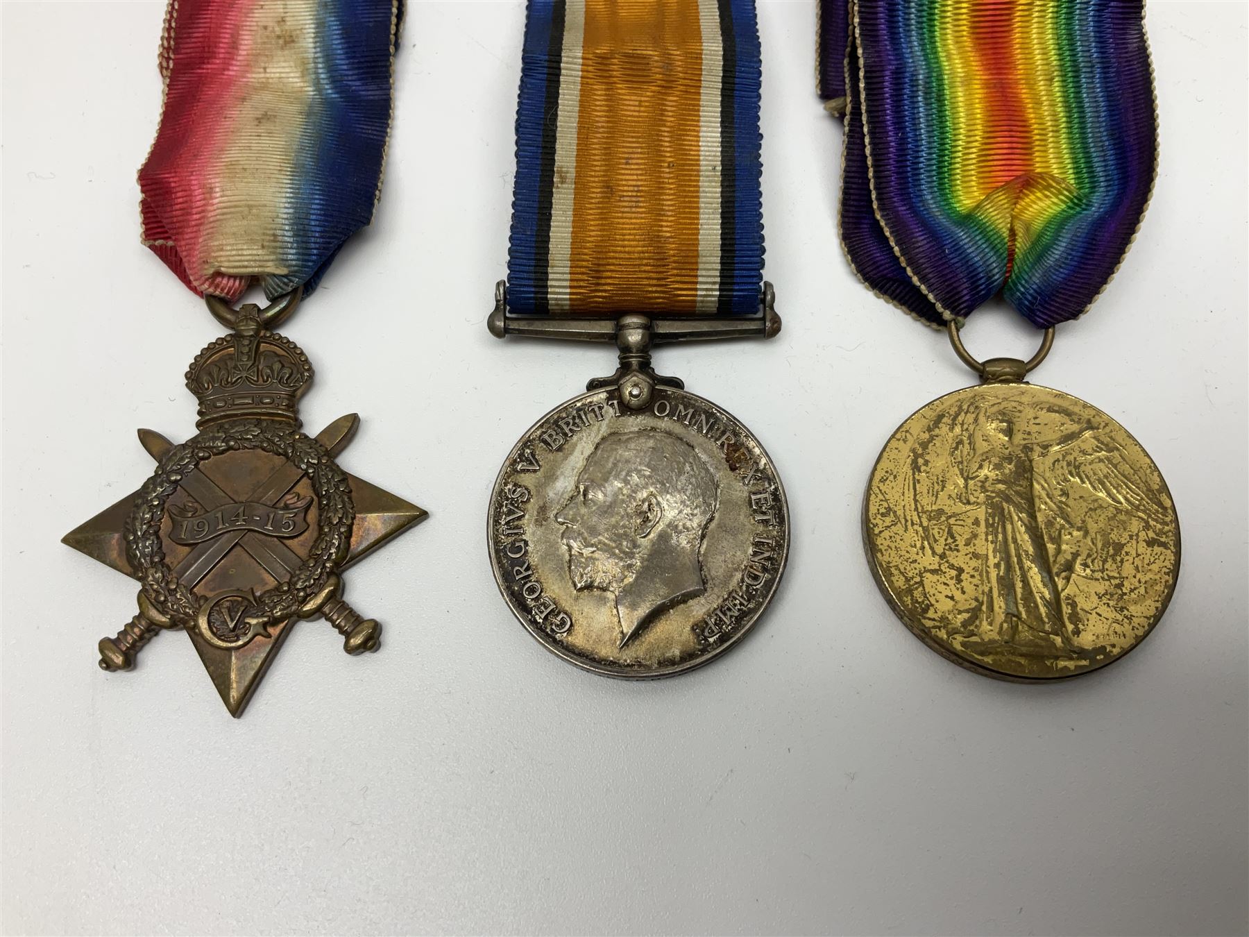 WW1 group of three medals comprising British War Medal, Victory Medal and 1914-15 Star awarded to 90434 Gnr. R.G. Rhodes R.F.A./R.A.; all with ribbons