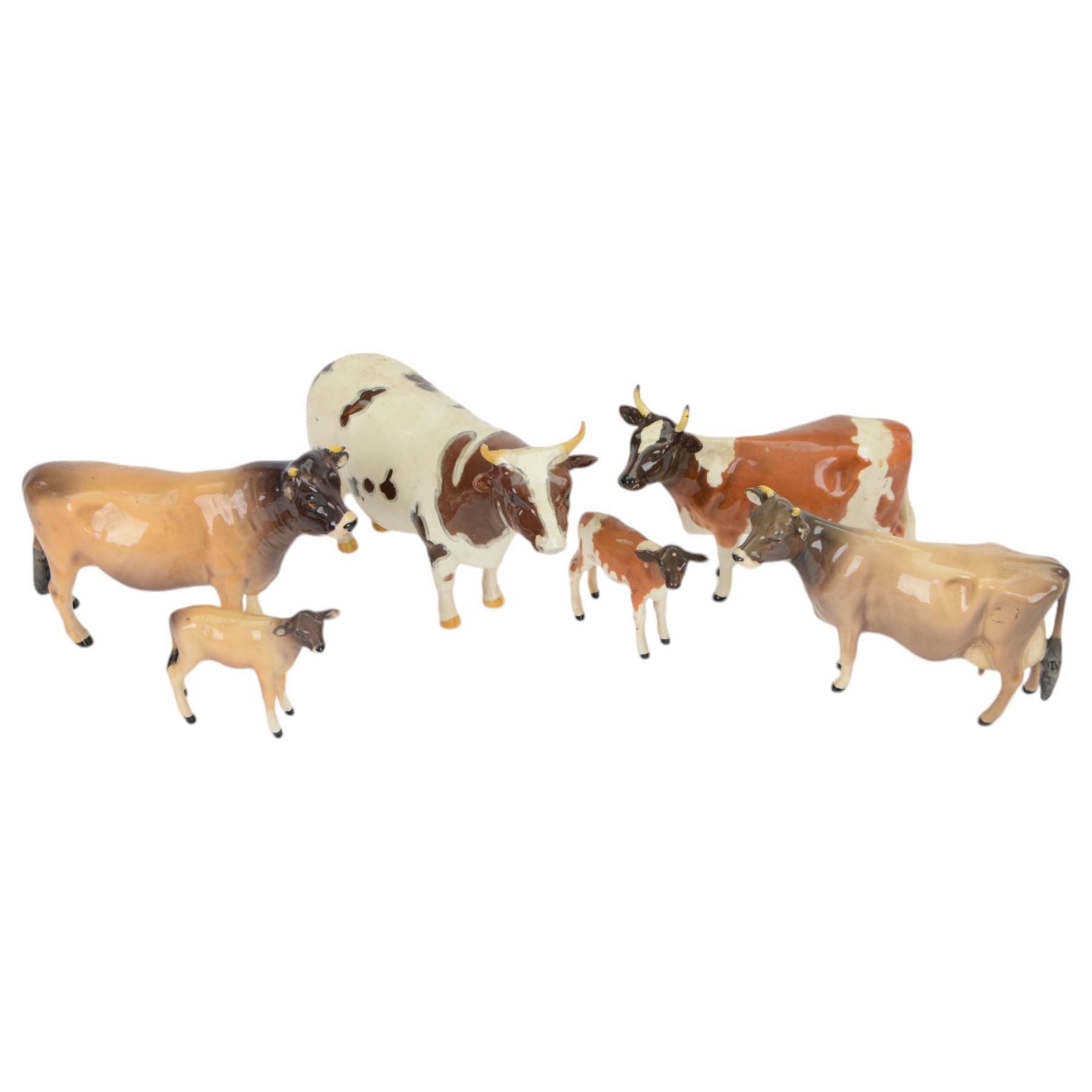 Six Beswick cattle figures, comprising Jersey family group; Bull Ch. Dunsley Coy Boy, model 1422, Cow Ch. Newton Tinkle, model 1345 and Calf, model 1249, Ayrshire family group; Bull Ch. Whitehill Mandate, model 1454, Cow Ch. Ickham Bessie, model 1350, and Calf, model 1249