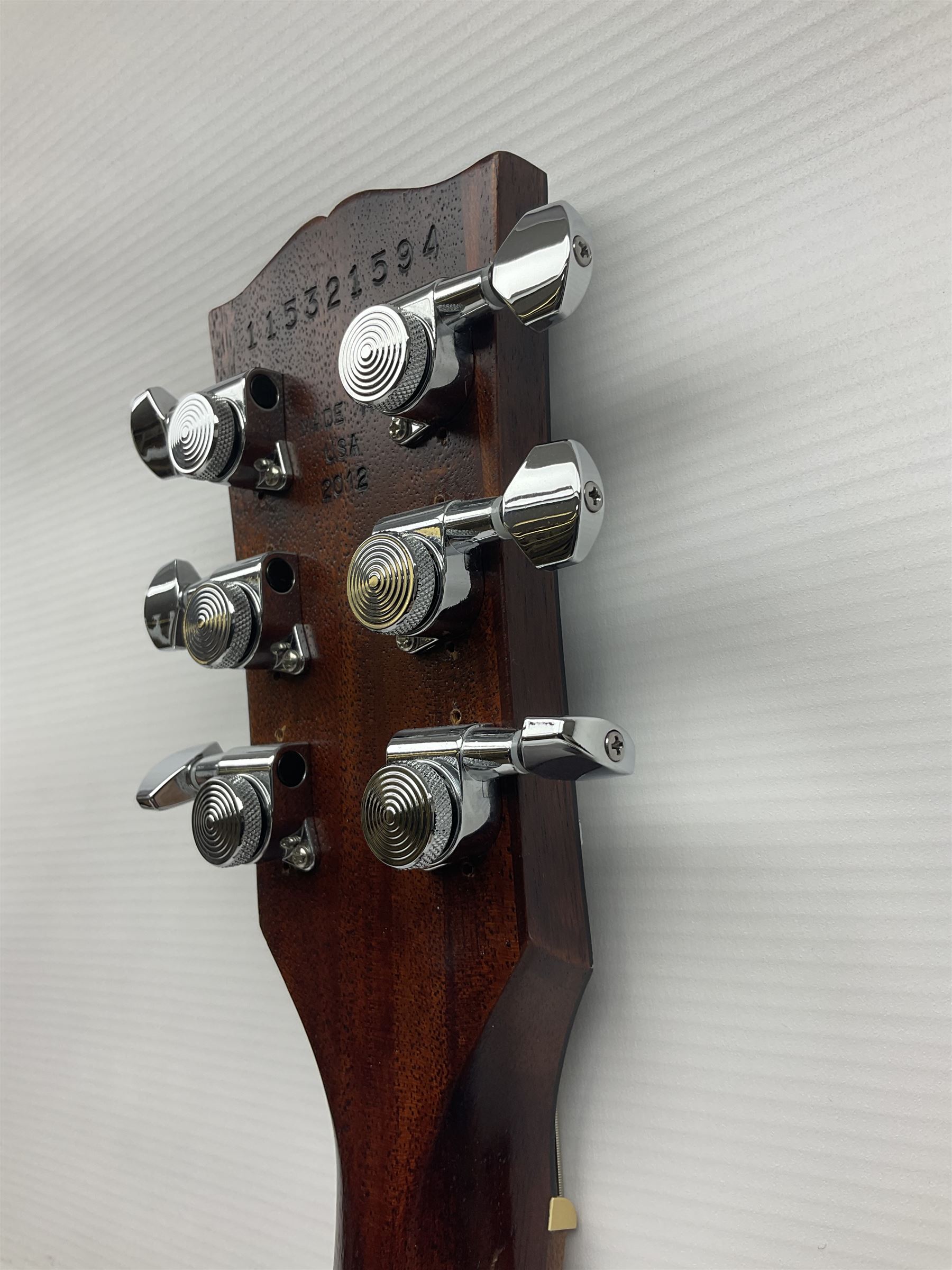 2012 American Gibson Les Paul Studio electric guitar, retro fitted with iron gear pick-ups, push-pull 'pots', roller bridge, string butler and locking machines, serial no.115321594, L99cm overall; in Gibson soft carrying case.
