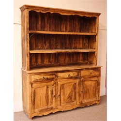  Large hardwood dresser with raised two tier rack, projecting cornice, three drawers above three cupboards, shaped apron, W181cm, H217cm, D53cm  