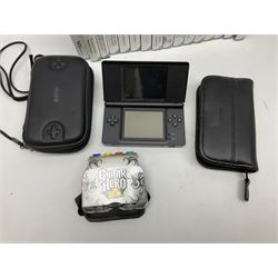 Nintendo Wii console, four controllers with cases and four nunchucks, Wii sensor bar, balance board and dance mat. Guitar hero wireless guitar for Wii and Redoctane wired guitar. Nintendo DS lite handheld gaming console, console and game cases and Guitar Hero Redoctane Guitar Grip. Selection of Nintendo Wii and Nintendo DS lite games to include Super Mario Galaxy, Guitar Hero, Wii Fit, Legend of Zelda games etc. Archos AV400 Series pocket video recorder with accessories, cradle and remote, in three boxes