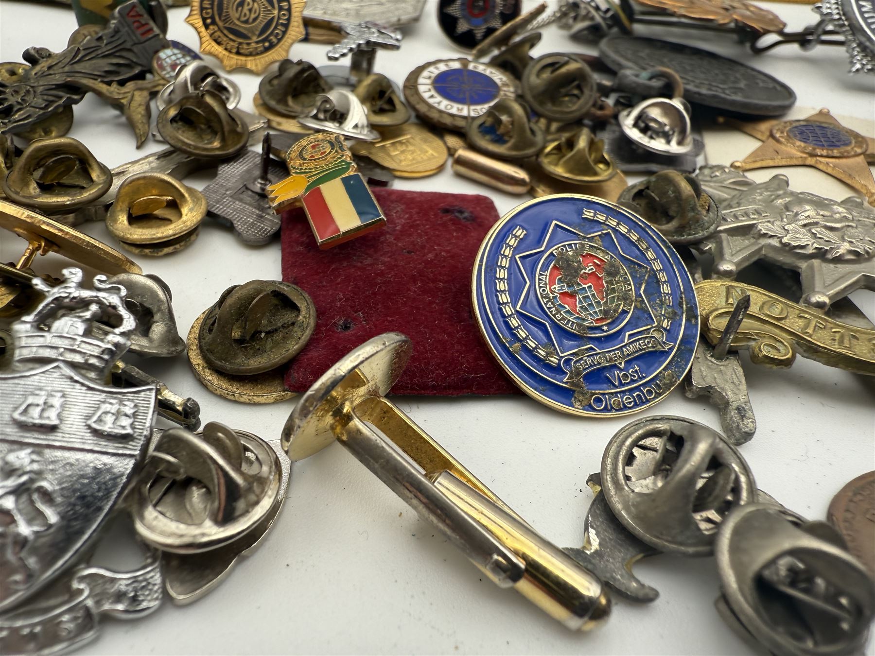 Collection of military and similar enamel badges, pin badges, cloth badges and brasses