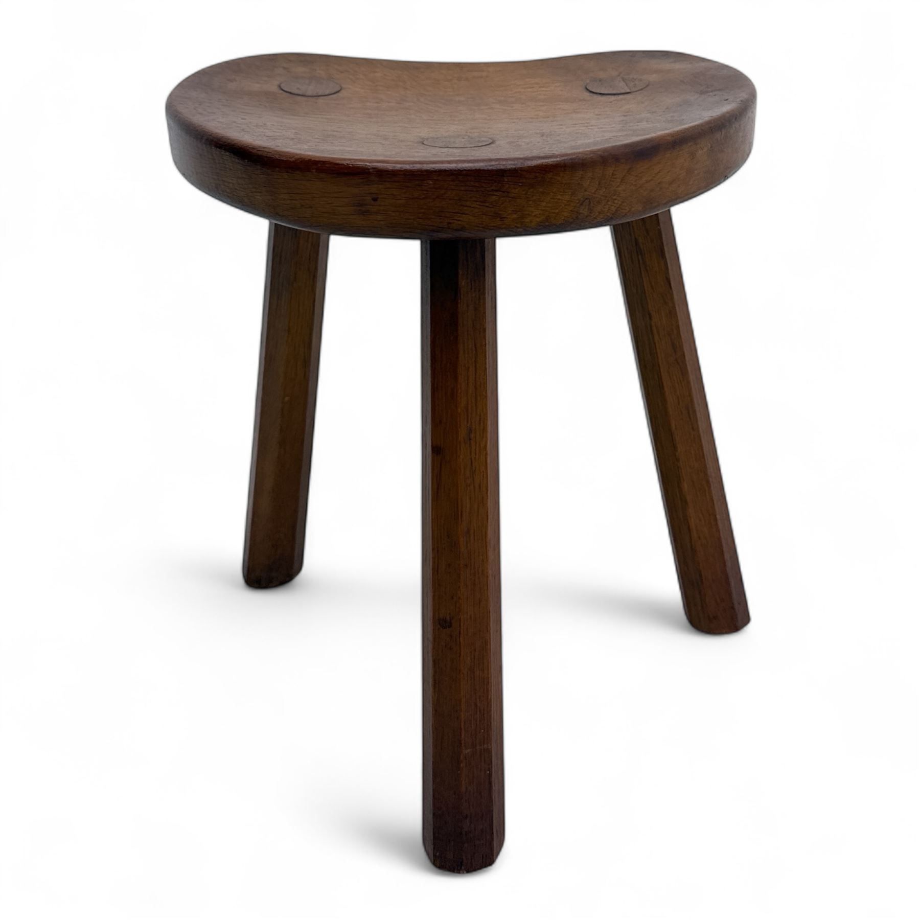 Mouseman - oak three-legged calf stool, kidney-shaped seat carved with the signature mouse motif, by the workshop of Robert Thompson, Kilburn
