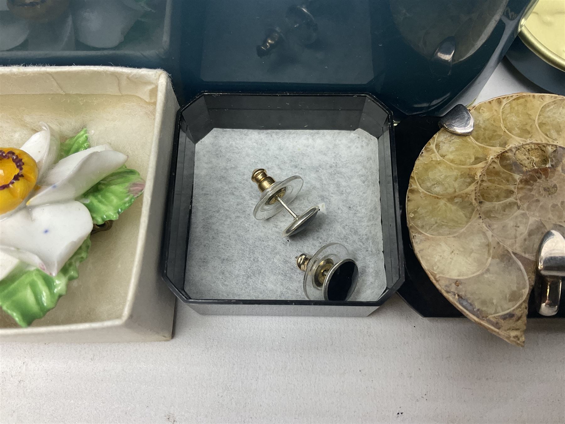 Silver ammonite pendant, silver earrings and a collection of beaded and other costume jewellery