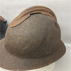 Three battlefield relic helmet shells - WWI German M16; WWI French Adrian; and WWII British (3)