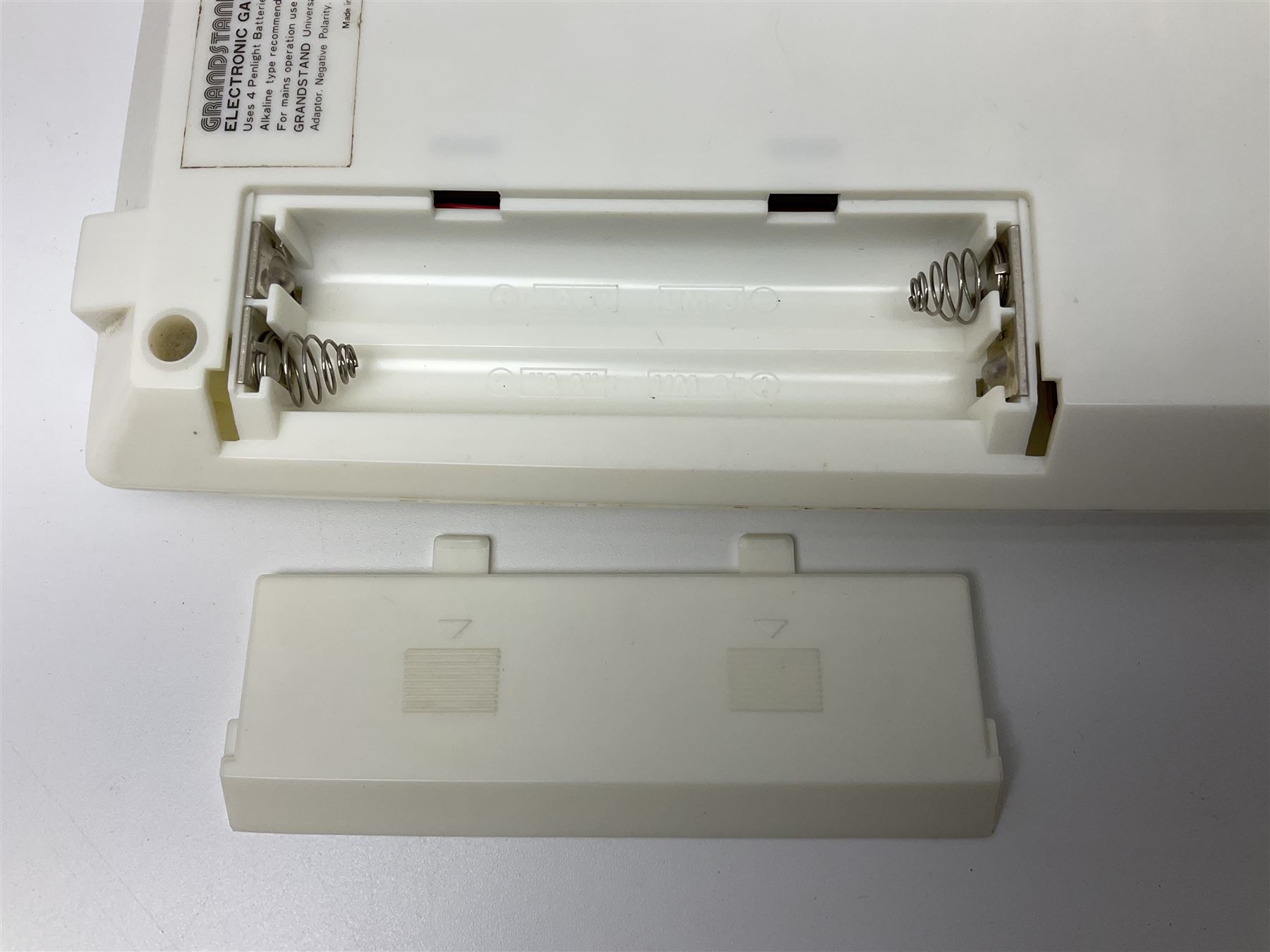 Three late 70s/early 80s handheld electronic games; Bandai Electronics Arcade ‘Gunfighter’ (1980), Grandstand ‘Invader From Space’ (1980), Palitoy ‘Merlin The Electronic Game Machine’ (1979) with game sheet and instruction booklet, all with original boxes (3) 