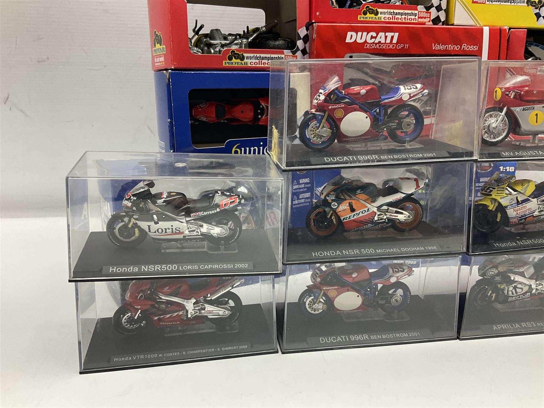 Fifty-one die-cast models of motorcycles by Maisto, Protar Italeri, Welly etc; many in perspex display boxes, some in window boxes and some unboxed