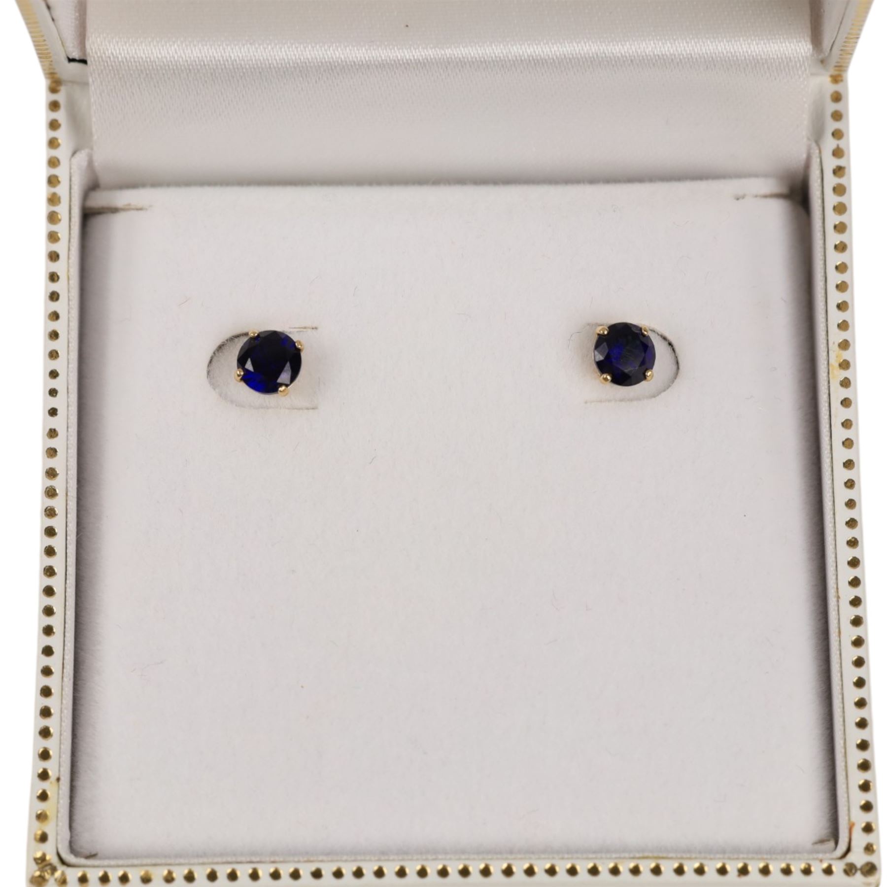 Pair of 9ct gold blue stone stud earrings, boxed