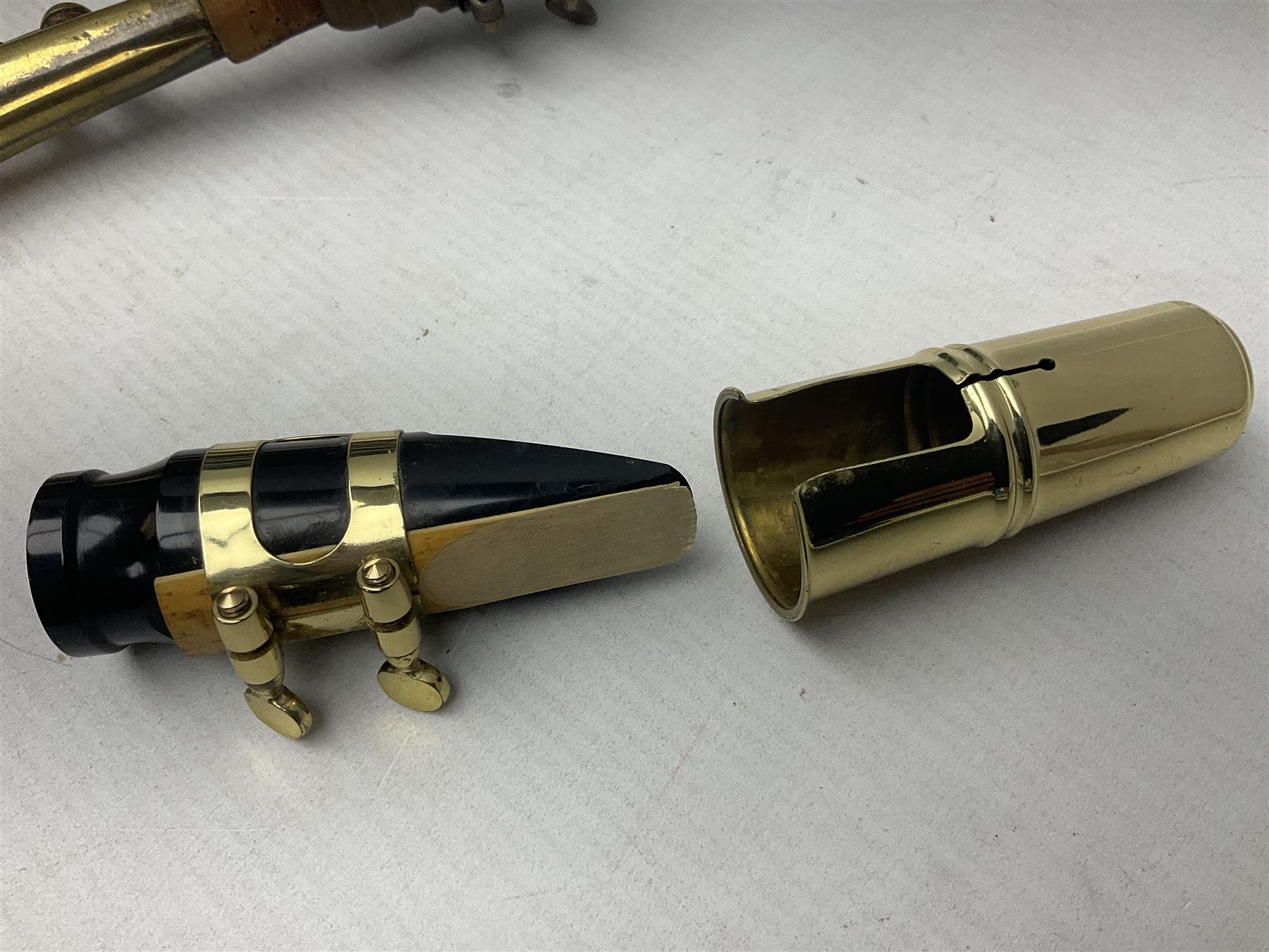 Lacquered brass 'King' alto saxophone inscribed Made by the H.N. White Co.' (Cleveland Ohio) with crook, serial no.84128; also stamped No.1 549 911 and Pat D 8-18-25; in fitted carrying case 