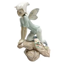 Lladro Privilege figure, Prince of Elves, modelled as an elf with wings leaning upon a rock, with original box, no 7690, sculpted by Joan Coderch, year issue 2001, year retired 2003, H23cm