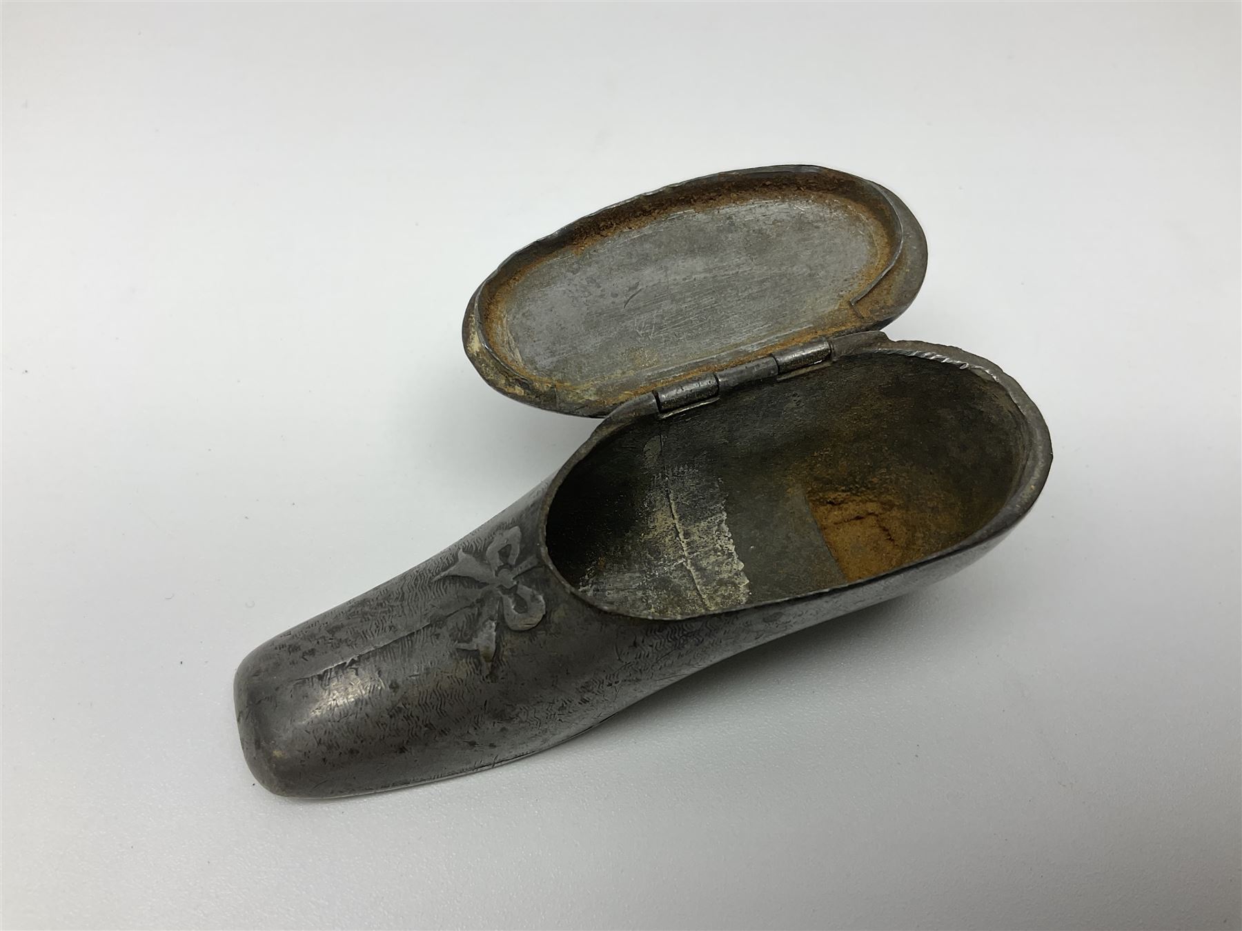 Five snuff boxes, including novelty snuff box in the form of a shoe, pierced example, rectangular hinged lid with white metal decoration and two others  