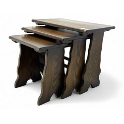 20th century oak nest of three tables, each with rectangular top and shaped end supports, ...