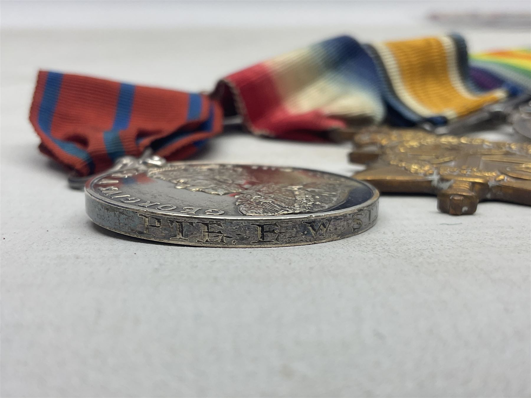 WW1 Naval group of four medals comprising British War Medal, 1914-15 Star and Victory Medal awarded to M.10222 E.W. Starmer J.R.A. (later S.R.A.) R.N.; and St. John Ambulance Brigade Coronation 1911 Medal to Pte. E.W. Starmer; all with ribbons