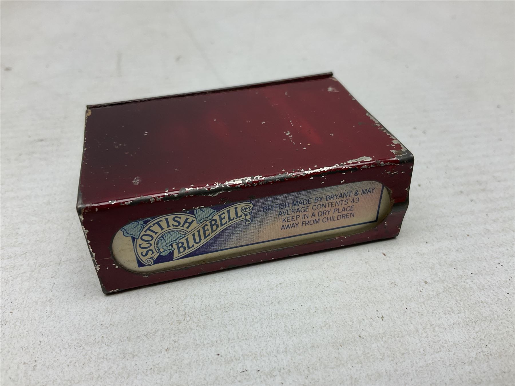 Victorian leather cigar protector with metal match striking plate on the end and internal spring to hold the cigars in place; expands for differing lengths of cigar, minimum L12.5cm; another similar leather cigar case marked Middlemore's Patent with attached vesta case and striker; three Bryant & Mays tin-late matchbox holders including 1935 Jubilee; and small box of matches (6)