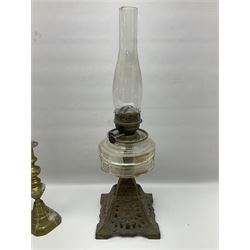 Late 19th century/early 20th century oil lamp, with with glass chimney and Rowatt & Co burner on ornate metal base, together with a pair of brass candlesticks, table lighter, Victorian fob medal and other collectables