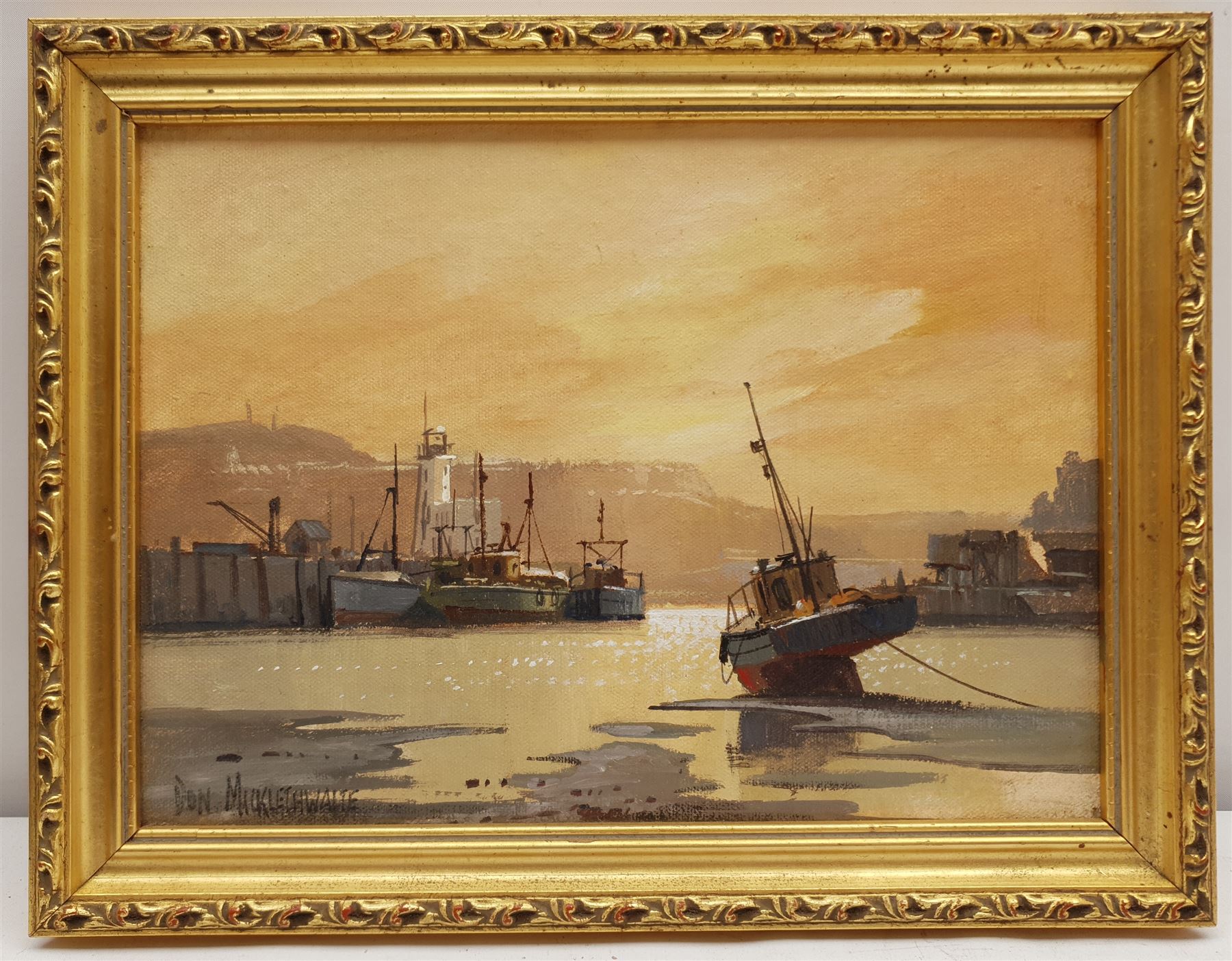 Don Micklethwaite (British 1936-): Sunset Scarborough Harbour, oil on board signed 21cm x 29cm