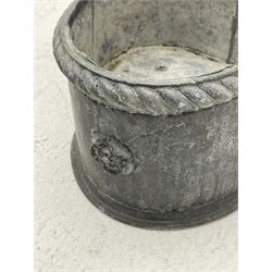 Lead jardinière planter of trefoil form, rope twist moulded rim and decorated with flower heads motifs