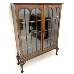Early 20th century display cabinet enclosed by two astragal glazed doors, three adjustable shelves, cabriole legs