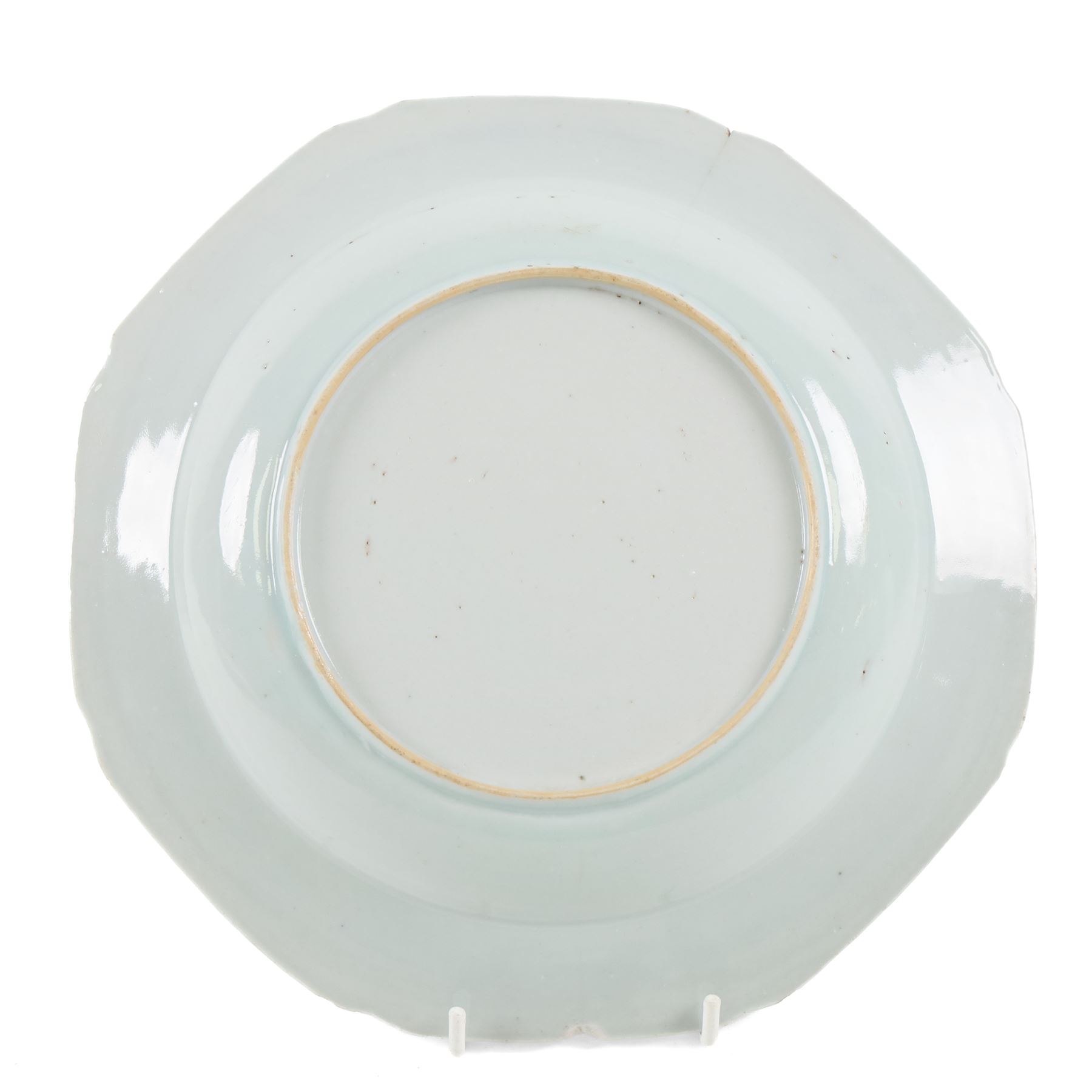 Two 18th century Chinese blue and white plates, comprising octagonal example with figural scene to centre and a larger circular example decorated with a garden scene, largest D27.5cm