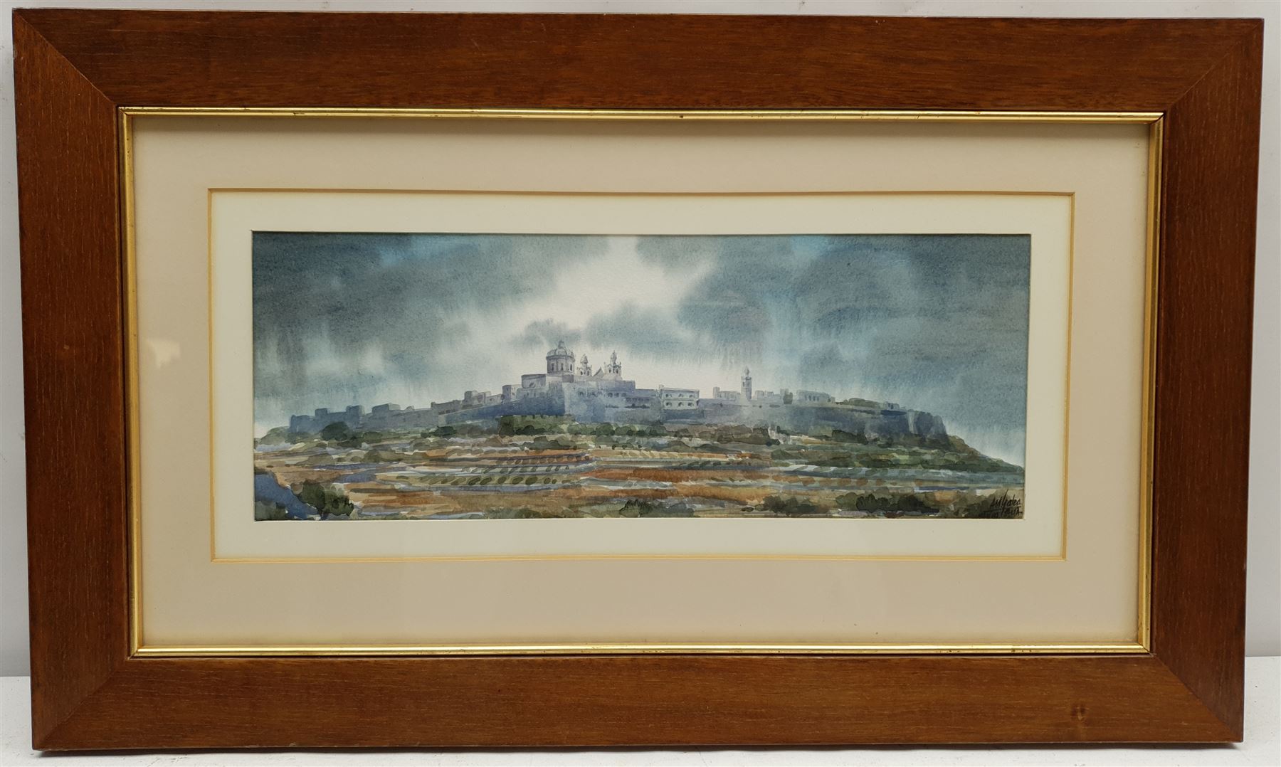 Aldo M Galea (Maltese 1953-): 'The Silent City Mdina', watercolour signed and dated 1989, 15cm x 40cm
