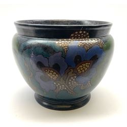 A 20th century Decoro jardinaire, with stylised foliate decoration in tones of blue and green, H25cm D29cm.