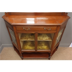  Victorian mahogany displayed cabinet, moulded top, raised arched bevel edged mirror back, projecting cornice, single drawer, four glazed doors enclosing three shelves, turned supports joined by an under tier, W128cm, H184cm, D47cm  