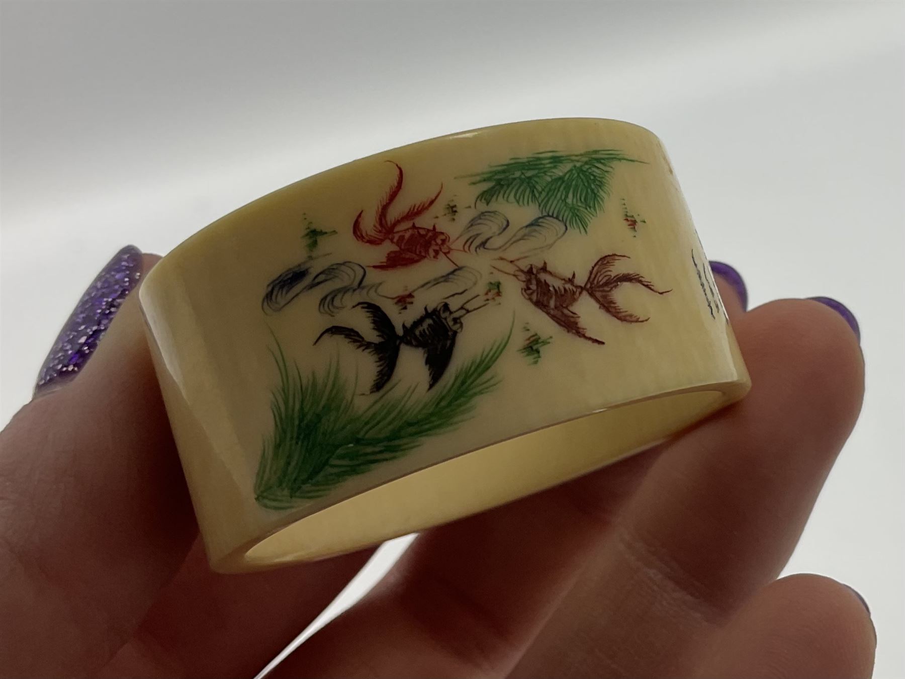 Set of six early 20th century Chinese ivory napkin rings decorated with figural scenes and calligraphy