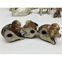 Group of Beswick figures to include leopard no 1082, rabbits, swan, pheasant no 1226 etc, all with marks beneath