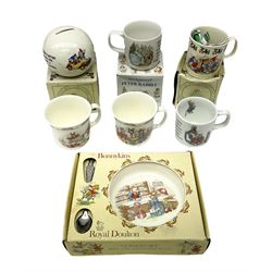 Royal Doulton Bunnykins nursery set in box and two cups, together with two Wedgwood Peter Rabbit mugs and Royal Staffordshire Noddy money box and cup (7)