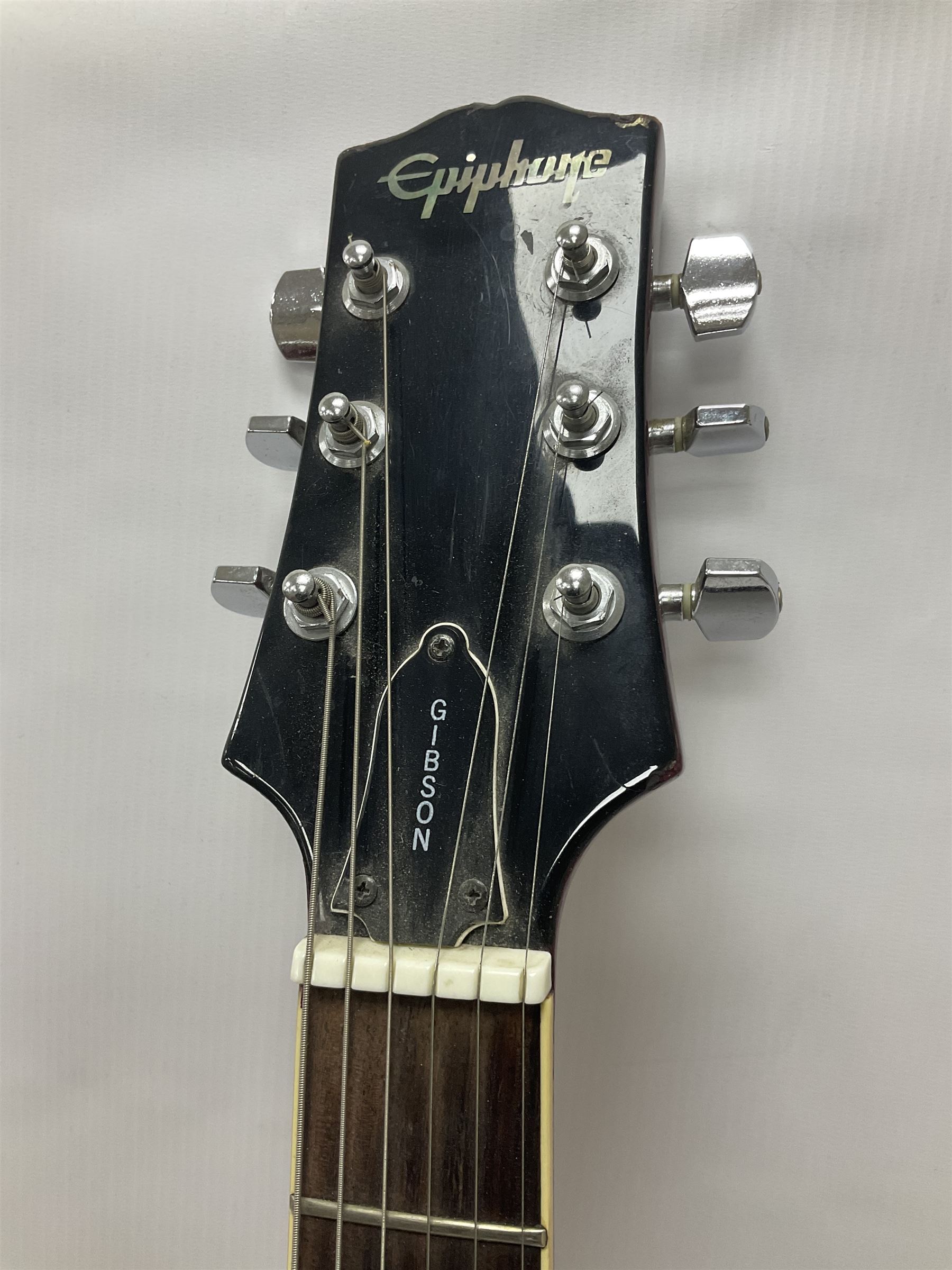 Gibson Epiphone SG six string electric guitar, with cherry red mahogany finish and black scratch guard, L102cm