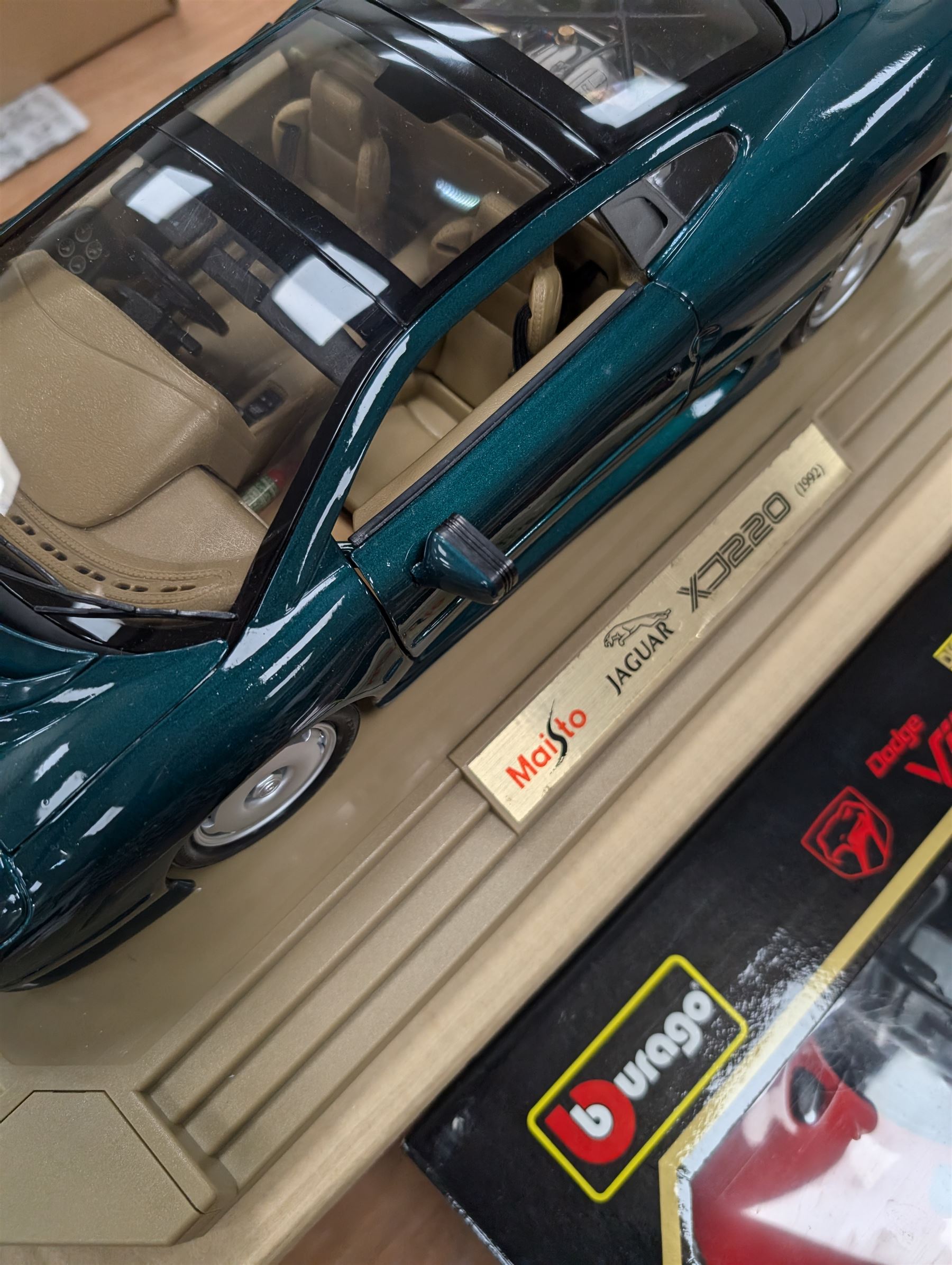 Two diecast cars, comprising Maisto 1:12 scale 1992 Jaguar XJ220 and a Burago 1:18 scale 1992 Dodge Viper RT10, both boxed