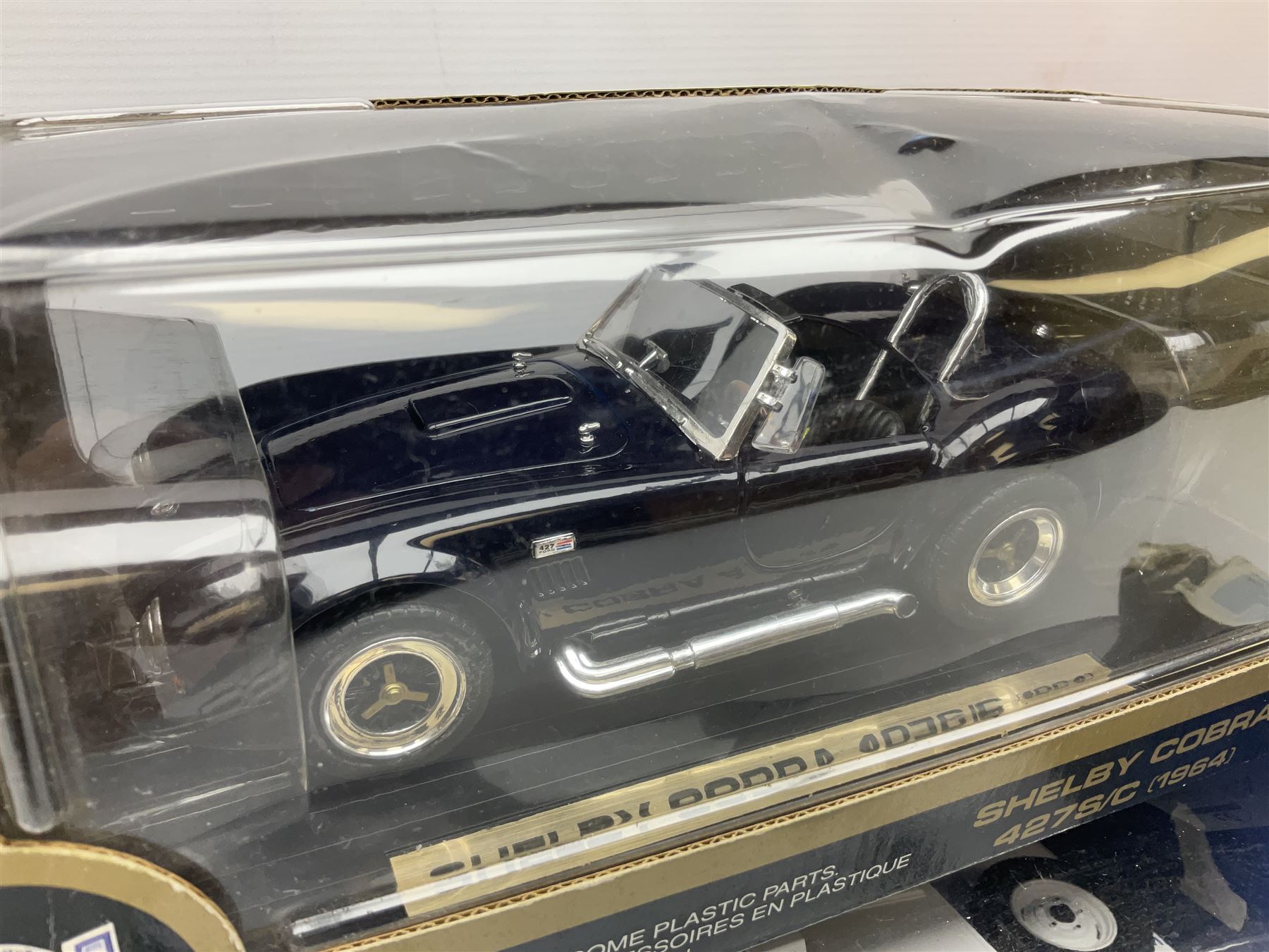 Six 1:18 scale die-cast models - Road Legends Chevrolet Nomad (1957) and Ford Fairlane Crown Victoria (1955); Universal Hobbies MGB-GT Mk.1 4-cylinder Old English White and Land Rover Serie III Police Patrol; Road Tough Shelby Cobra 427S/C (1964); and Mira 1955 Buick Century; all boxed (6)