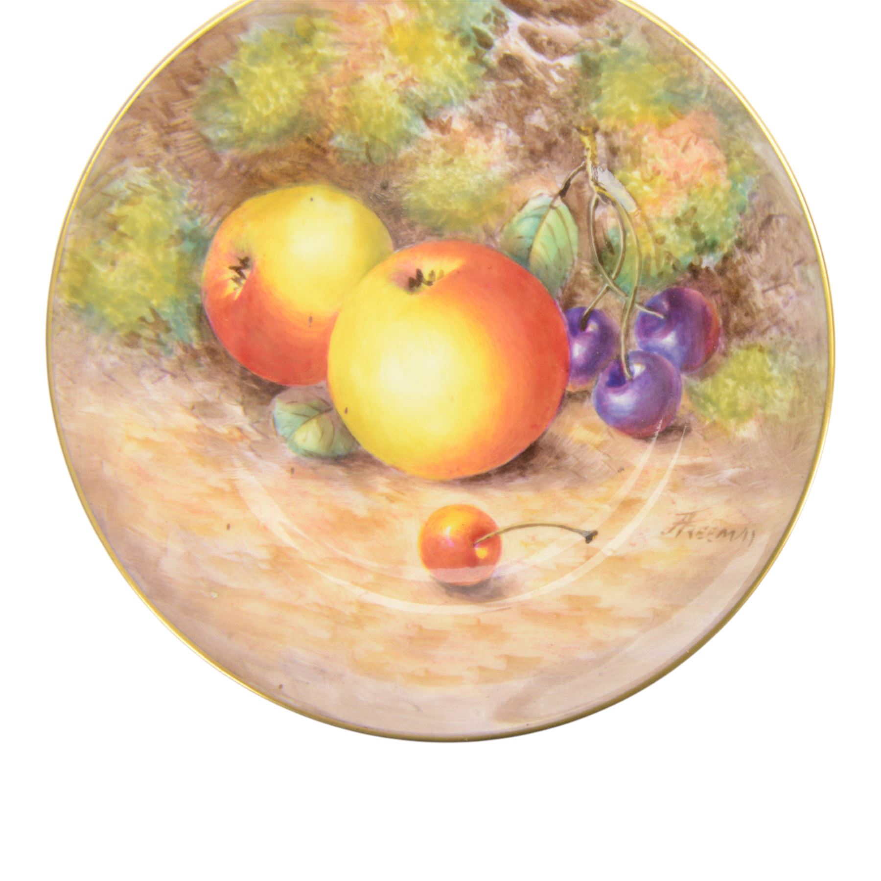 20th century Royal Worcester footed bowl, hand painted with gilt interior, the exterior a still life of fruit upon a mossy ground, signed Freeman, with black printed mark beneath, together with plate side plate and cabinet plate, bowl, H8cm, D13cm