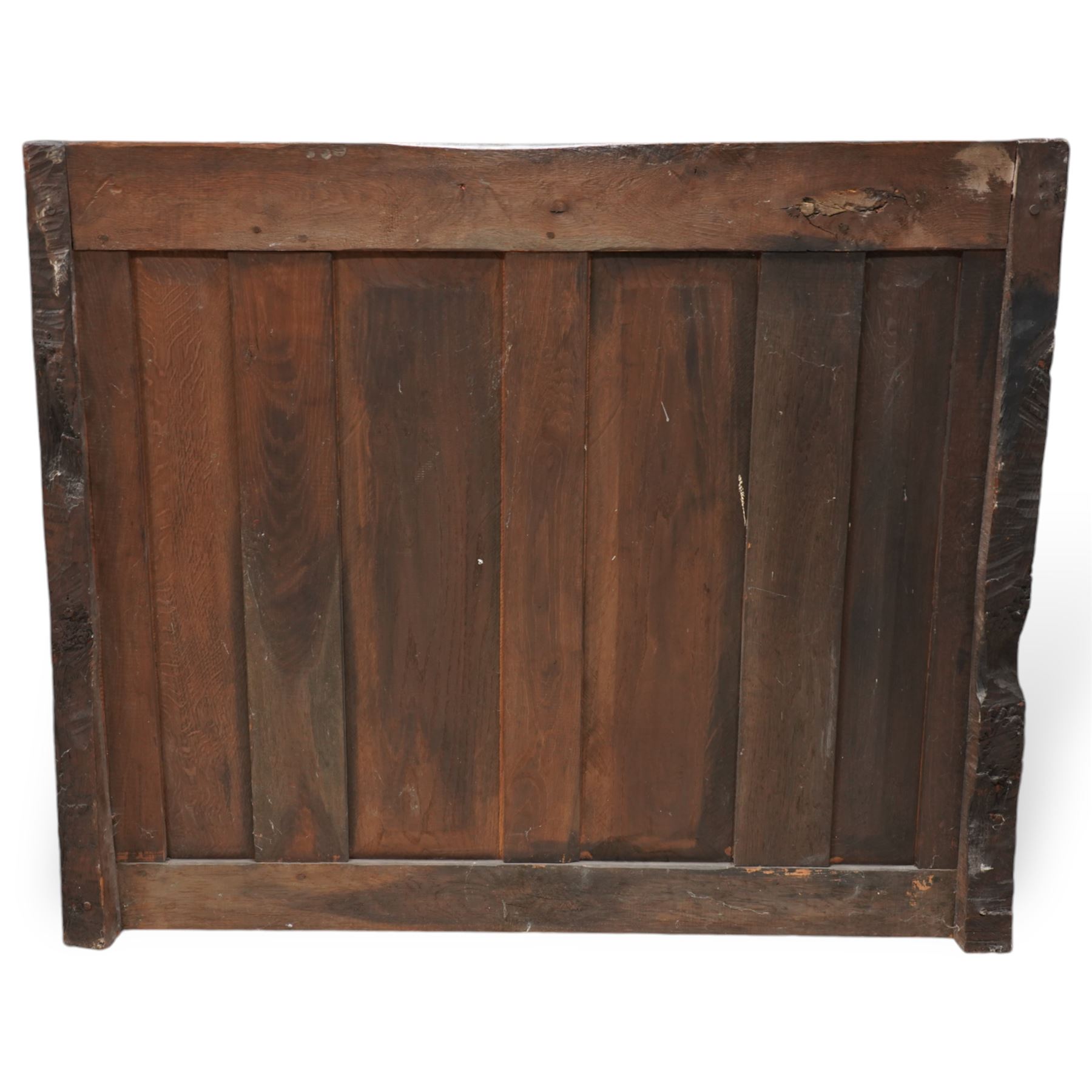Mouseman - circa. 1920s adzed oak settle or bench, the cresting rail carved with inscription 'Before Honour is Humility', four panel back and plank seat on shaped end supports carved with grotesque masks terminals, carved with mouse signature, by Robert Thompson of Kilburn 
