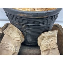 Modern reproduction automaton in the form of a baby doll in a basket clothed in Victorian style lace bloomers and frilled bonnet; clockwork action; on raised platform; with French paper label on base, 29cm wide,