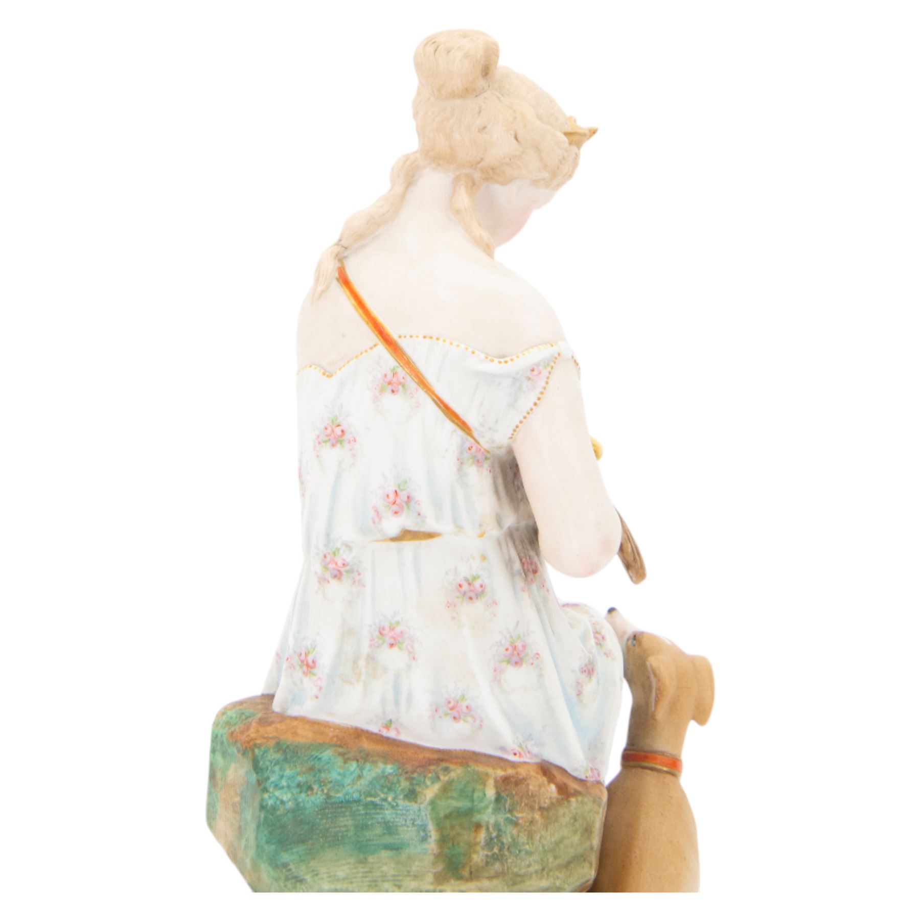  20th century bisque figurine, modelled as Artemis seated upon a rock, with impressed L&M mark beneath, H36cm
